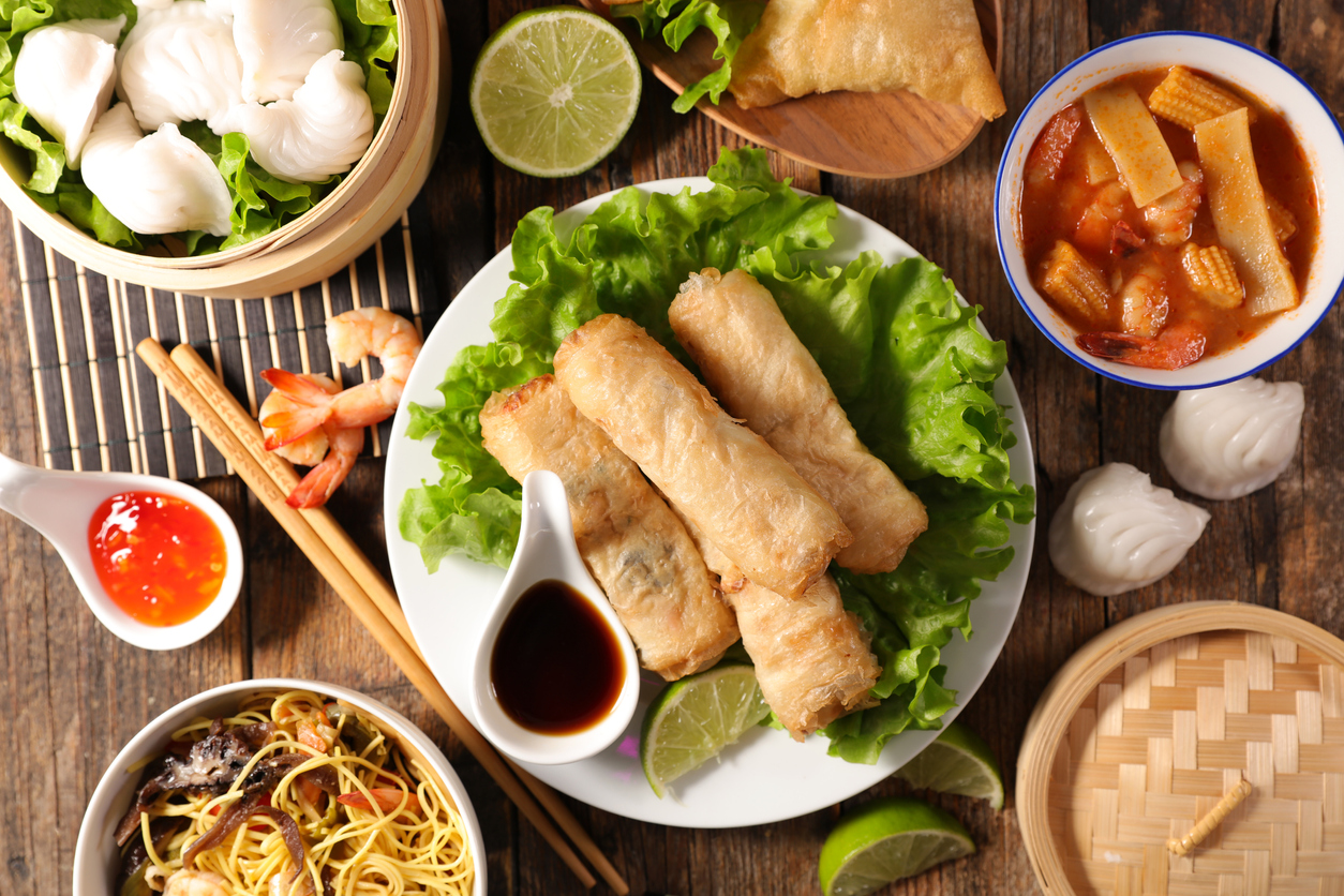 assorted of asian food- spring roll, noodles soup, dim sum